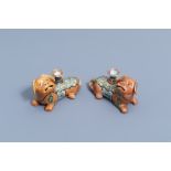 A pair of Chinese Canton famille rose dog shaped candlesticks, 19th C.