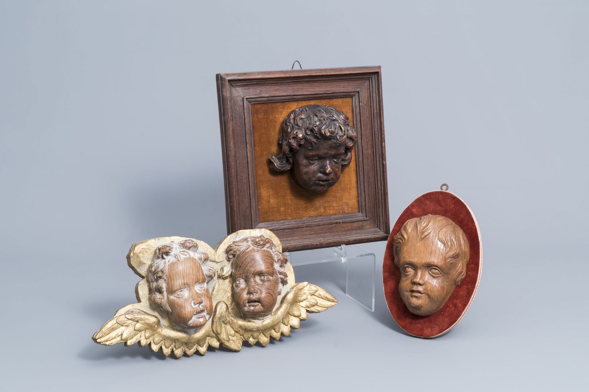 Four carved wooden putto and angel heads, Flanders, 17th C. and later