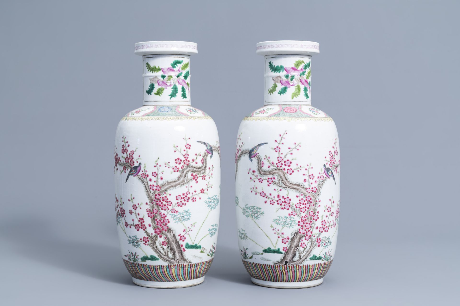 A pair of Chinese famille rose vases with birds among blossoming branches, 20th C.