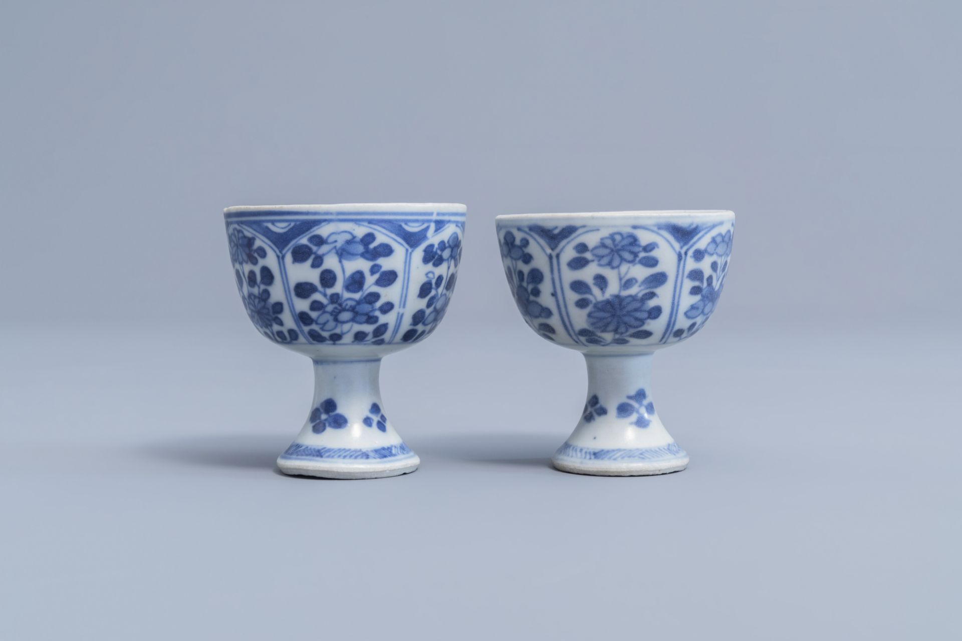 A pair of Chinese blue and white stem cups with floral design and a four-lobed teapot stand, Kangxi - Image 6 of 9