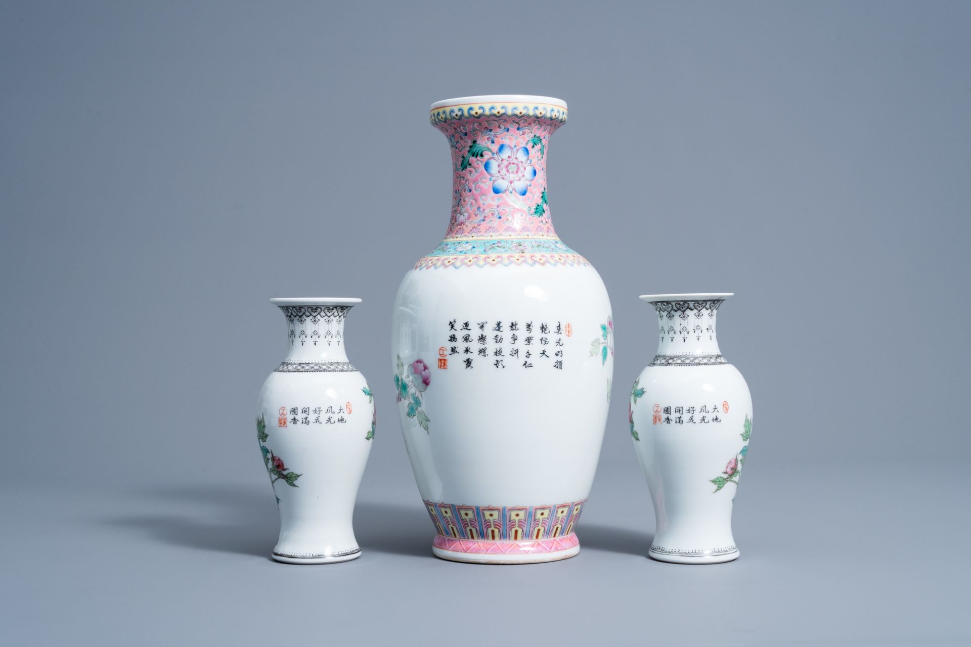 A pair of Chinese famille rose vases and a vase with floral design, 20th C. - Image 4 of 7