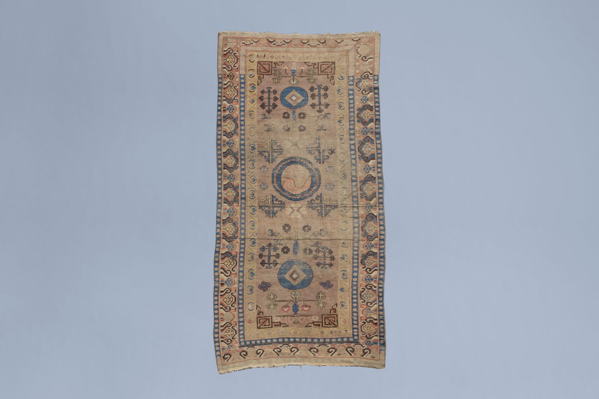 A Khotan rug with geometric design, wool on cotton, East Turkestan, 19th C.