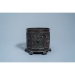 An inscribed Chinese reticulated bronze brush pot, Ming