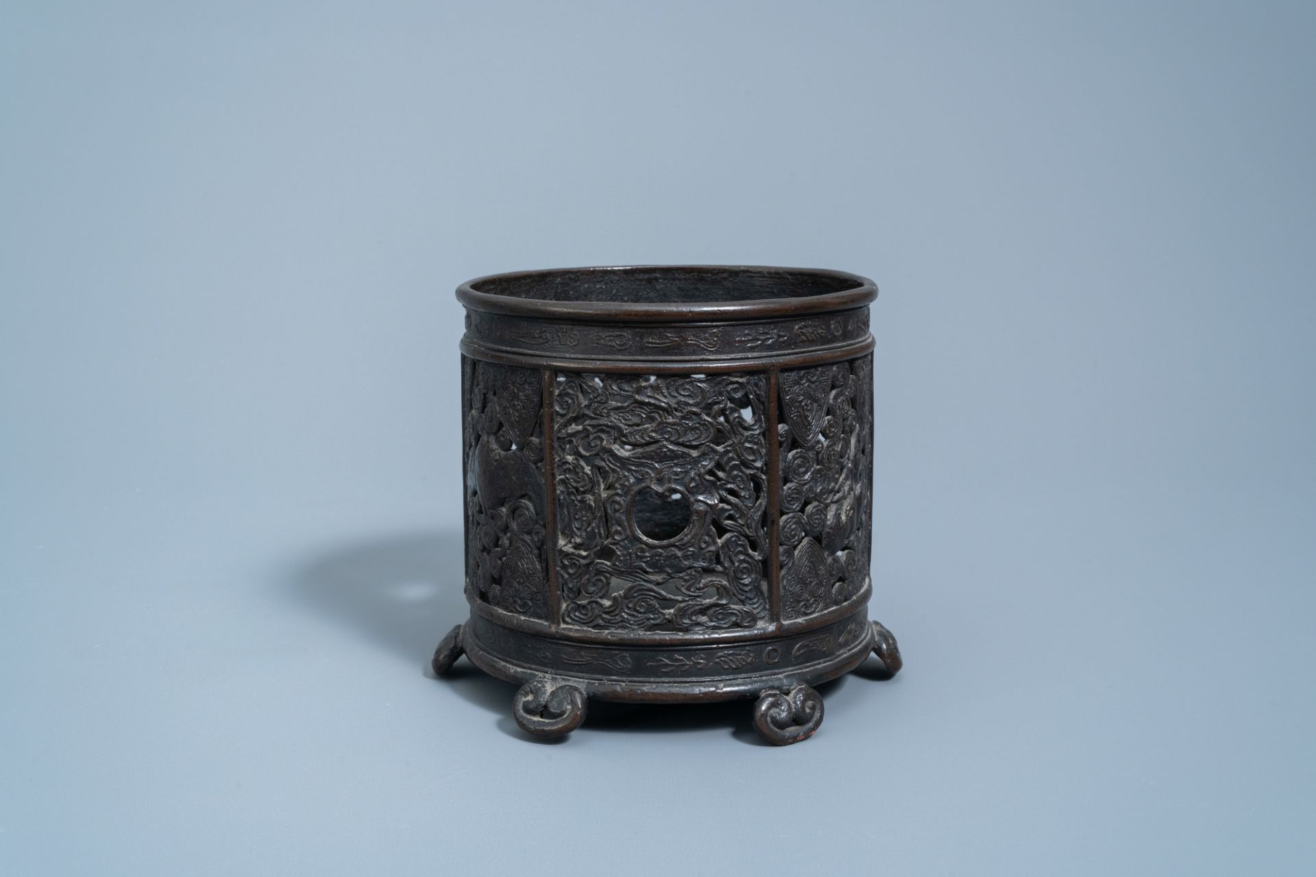 An inscribed Chinese reticulated bronze brush pot, Ming