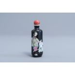 A Chinese famille rose black ground snuff bottle with figures, 19th C