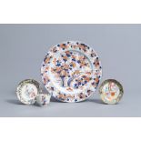 A Chinese Imari style charger with floral design and two famille rose saucers and a cup, 18th/19th C