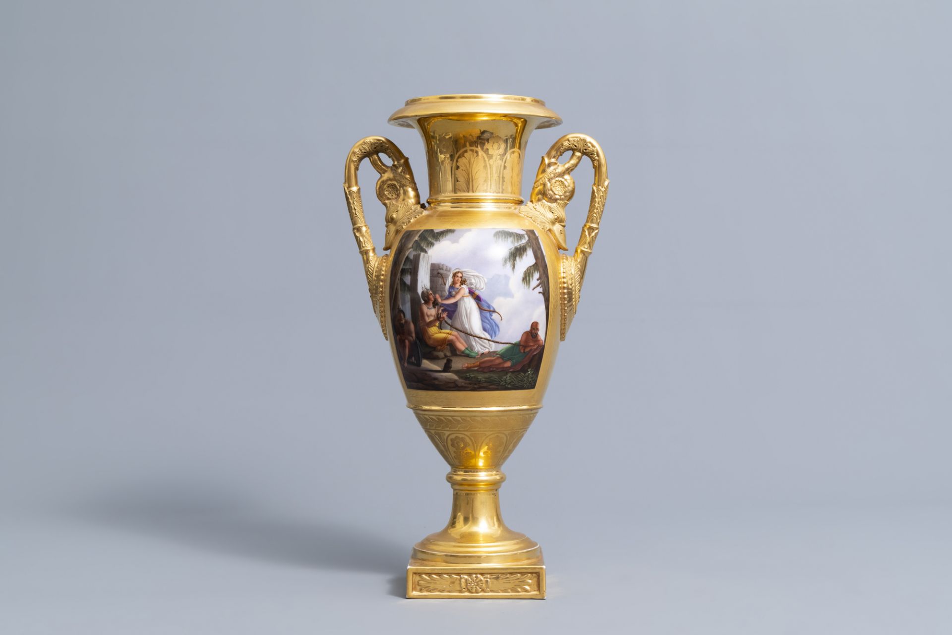 A French gilt and polychrome decorated Empire vase with a liberation in an exotic context, 19th C.