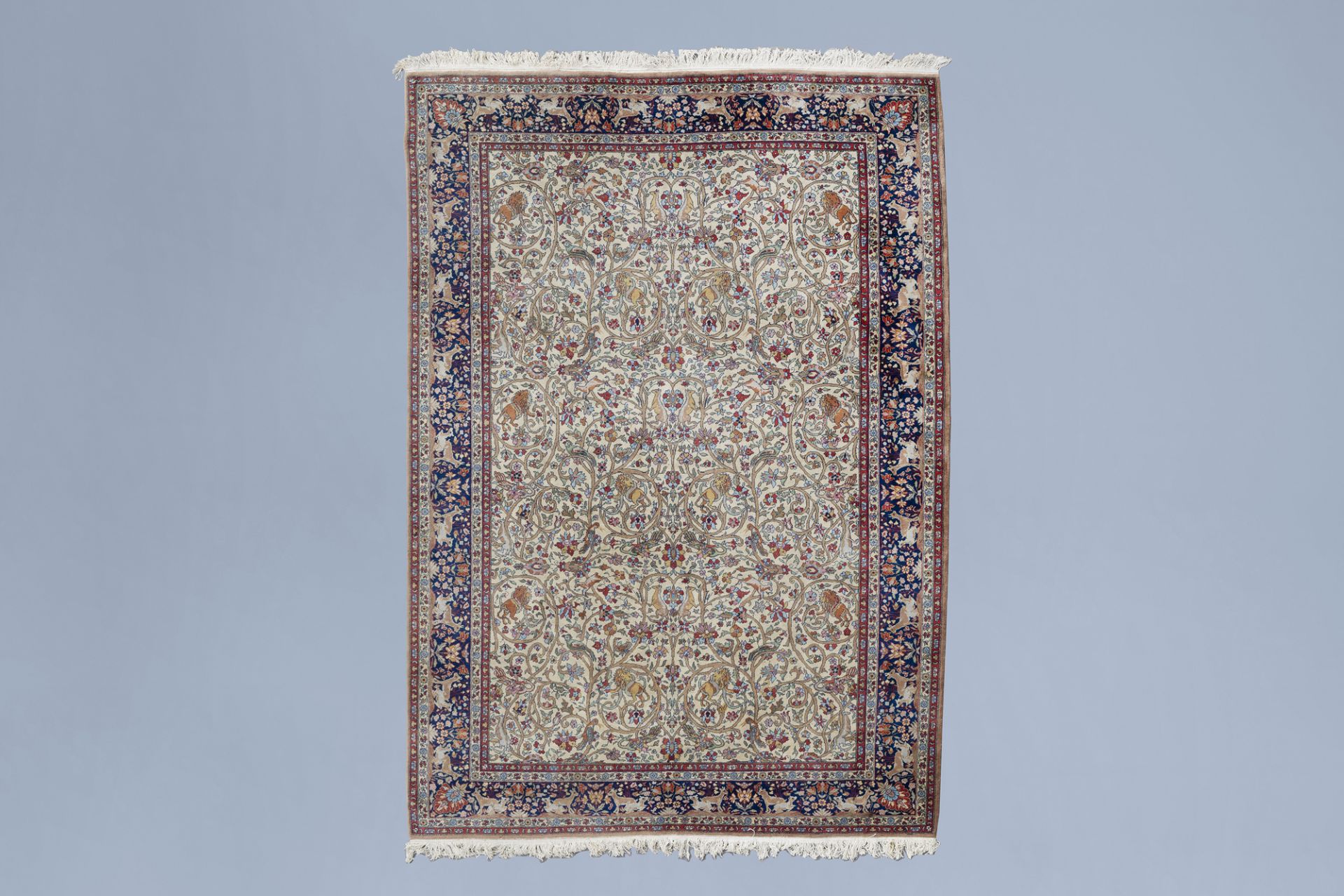 A large Persian Kerman rug with animals and floral design, wool on cotton, mid 20th C.