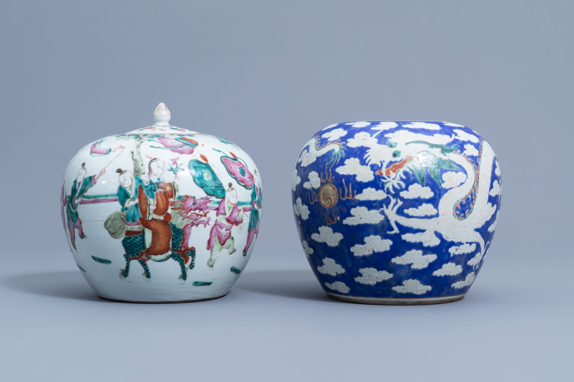 A Chinese famille rose jar and cover with figurative design and a blue ground 'dragon' jar, 19th C.