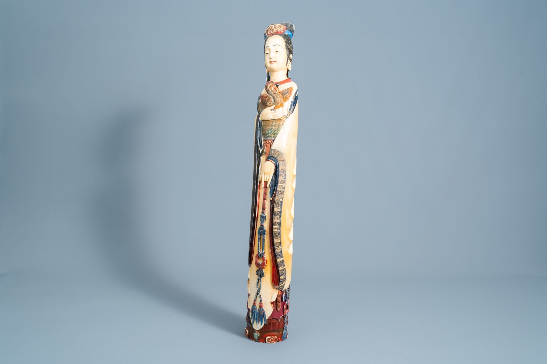 A large Chinese polychrome carved ivory figure of a lady with a rooster, ca. 1900