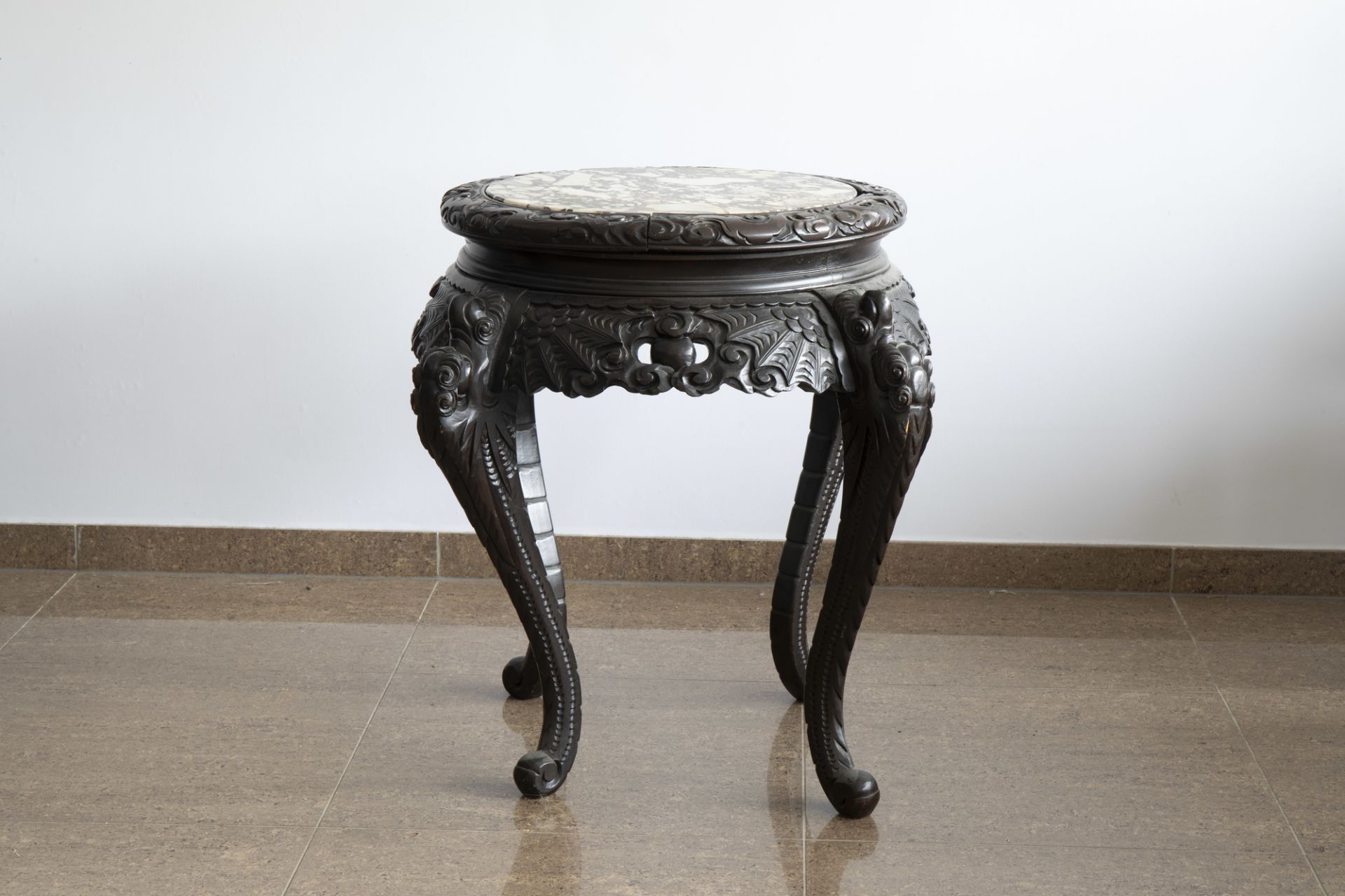 A Chinese or Japanese wooden table with marble top and dragon shaped legs, 20th C. - Image 3 of 7