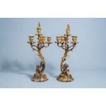 A pair of French gilt and patinated bronze Louis XV style five-light candelabra, 19th/20th C.