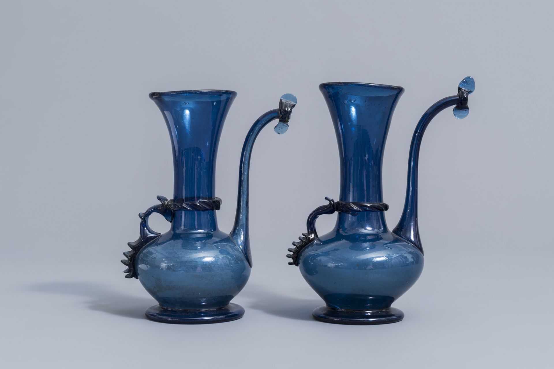 A pair of Islamic blue coloured relief decorated glass ewers or rosewater sprinklers, Qajar, Iran, 1 - Image 2 of 10