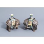 A pair of Chinese famille rose models of elephants carrying vases, 20th C.