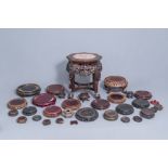 A collection of Chinese wooden stands and a carved wooden stand with marble top, 19th/20th C.