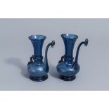 A pair of Islamic blue coloured relief decorated glass ewers or rosewater sprinklers, Qajar, Iran, 1