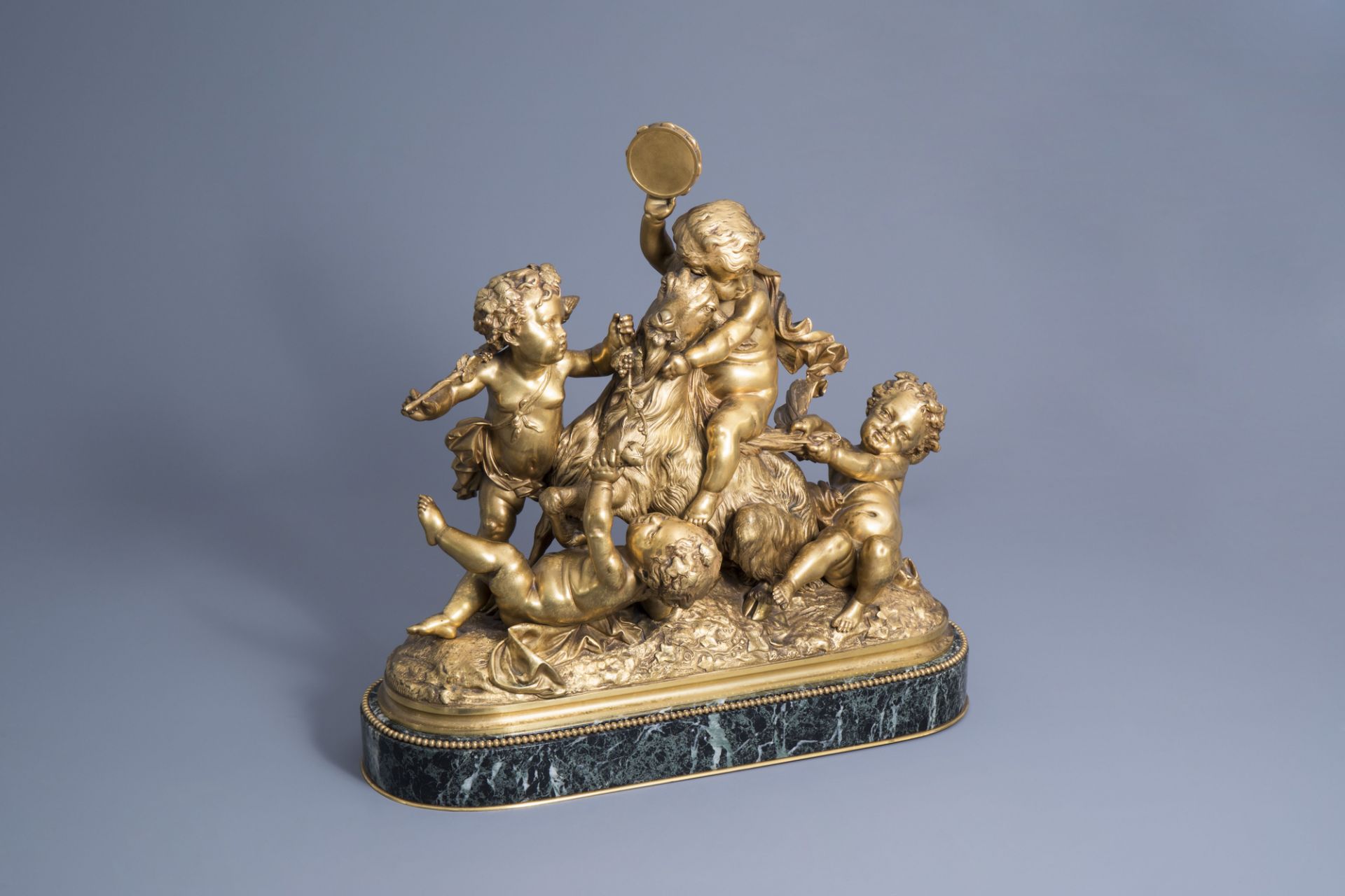 Albert-Ernest Carrier-Belleuse (1824-1887): Four putti making merry, gilt bronze on a vert de mer ma