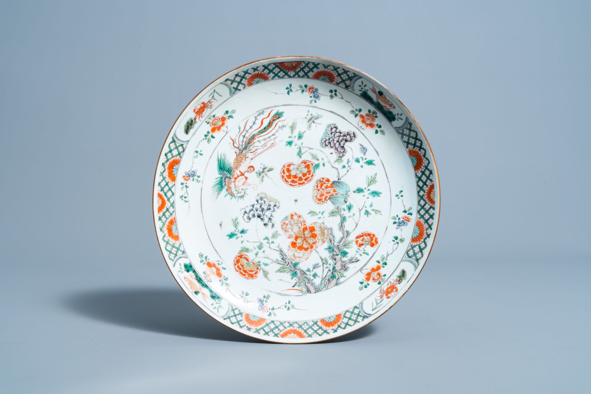 A Chinese famille verte charger with a phoenix among blossoming branches, Kangxi