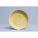 A Chinese yellow glazed anhua 'dragon' plate, Wanli mark, 19th/20th C.