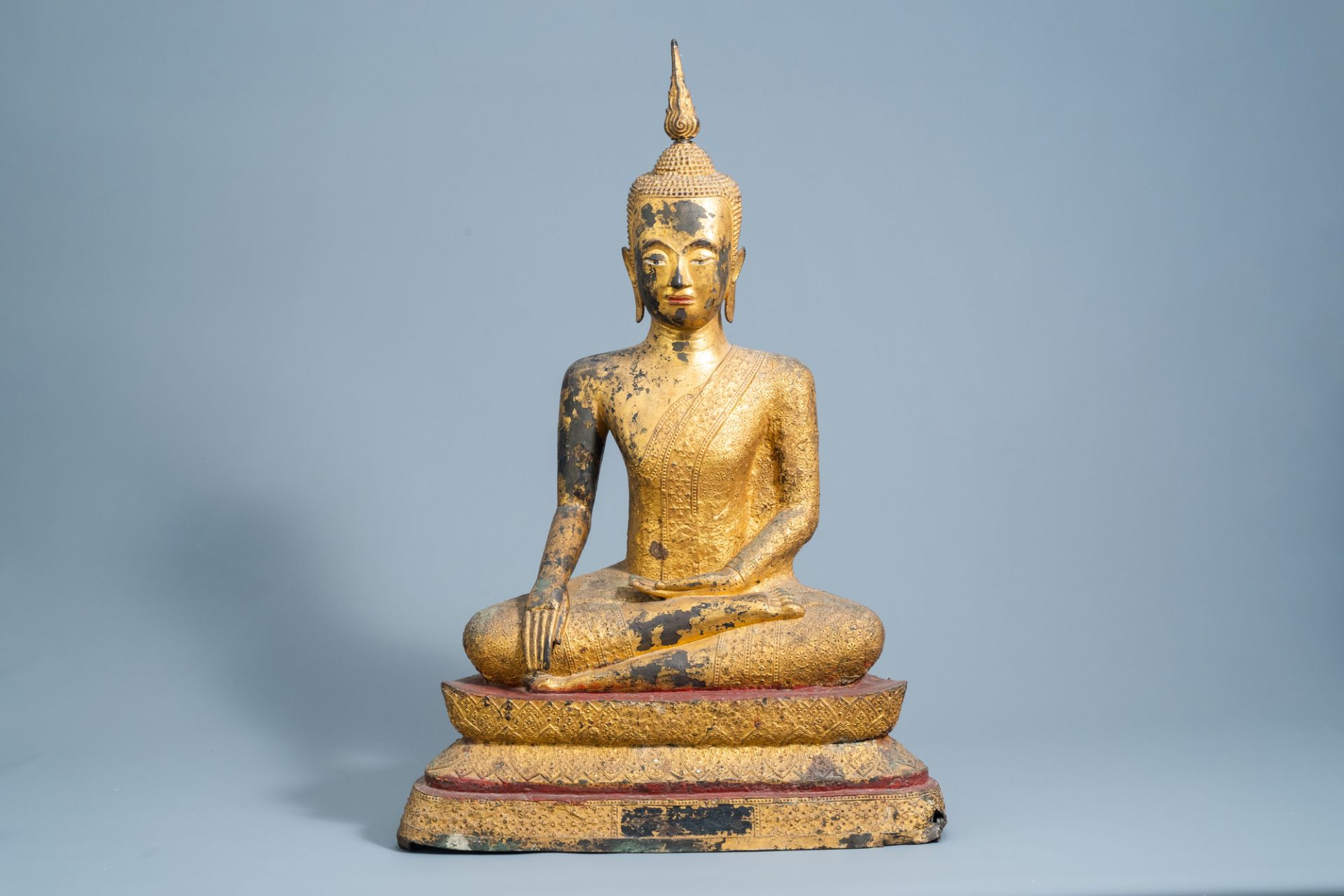 A large Thai gilt lacquered bronze figure of Buddha Maravijaya on a lotus throne, Rattanakosin, 18th