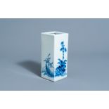 A square Chinese blue and white brush pot with floral design, marked, 20th C.