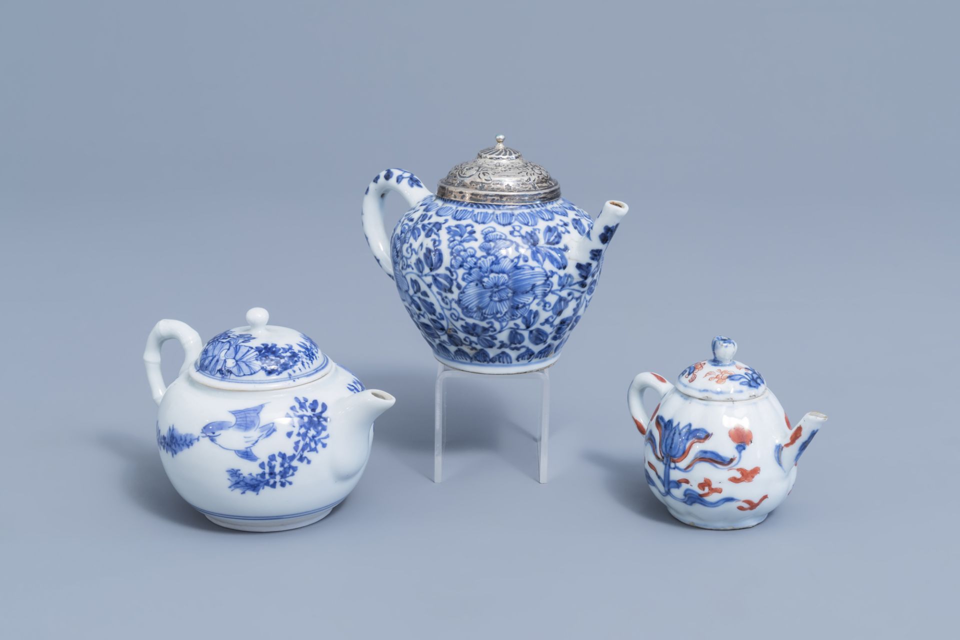 Two Chinese blue and white teapots and an Imari style teapot with floral design, Kangxi en later