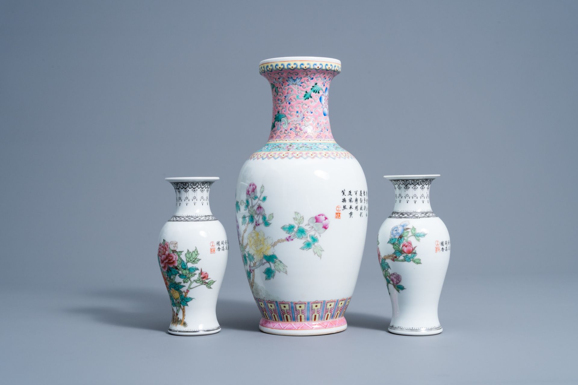 A pair of Chinese famille rose vases and a vase with floral design, 20th C. - Image 3 of 7