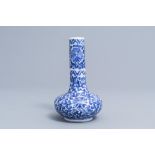 A Chinese blue and white 'lotus scroll' bottle vase, Wanli mark, 19th C.