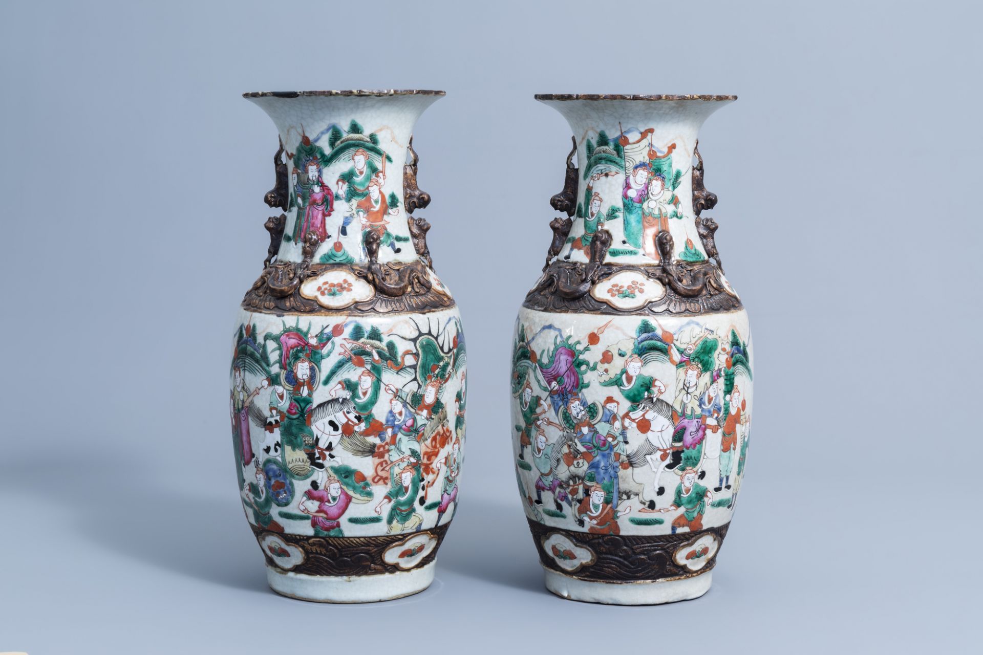 A pair of Chinese Nanking crackle glazed famille rose 'warrior' vases, 19th/20th C. - Image 3 of 6