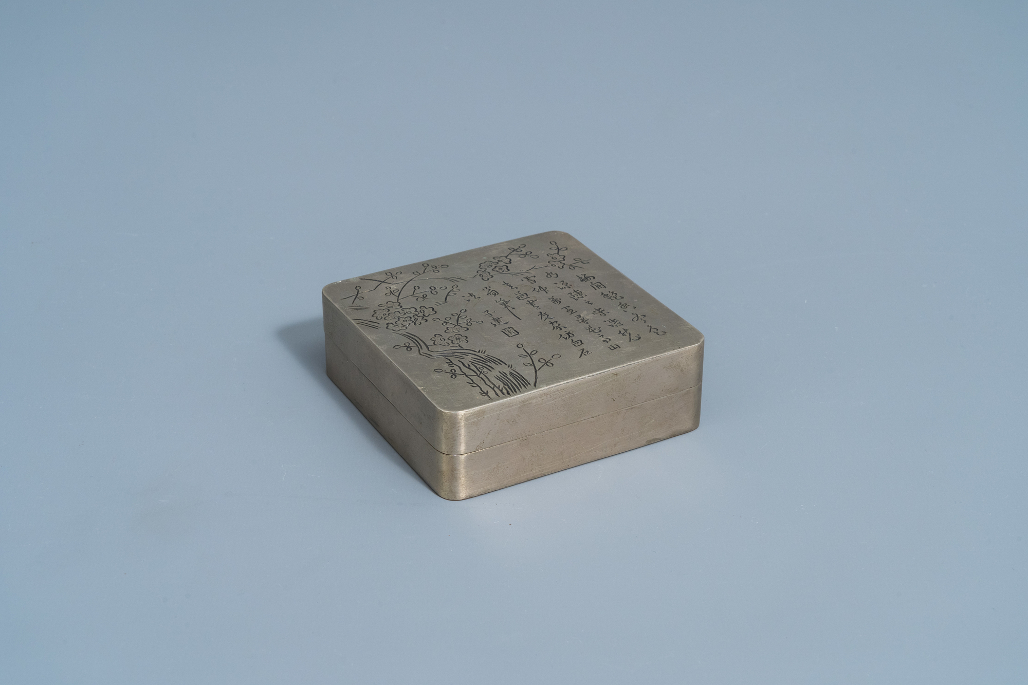 A Chinese square paktong metal scholar's ink box with calligraphy and floral design, marked, 20th C. - Image 2 of 9