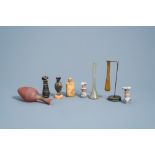 A varied collection of glass bottles and flasks, possibly Roman