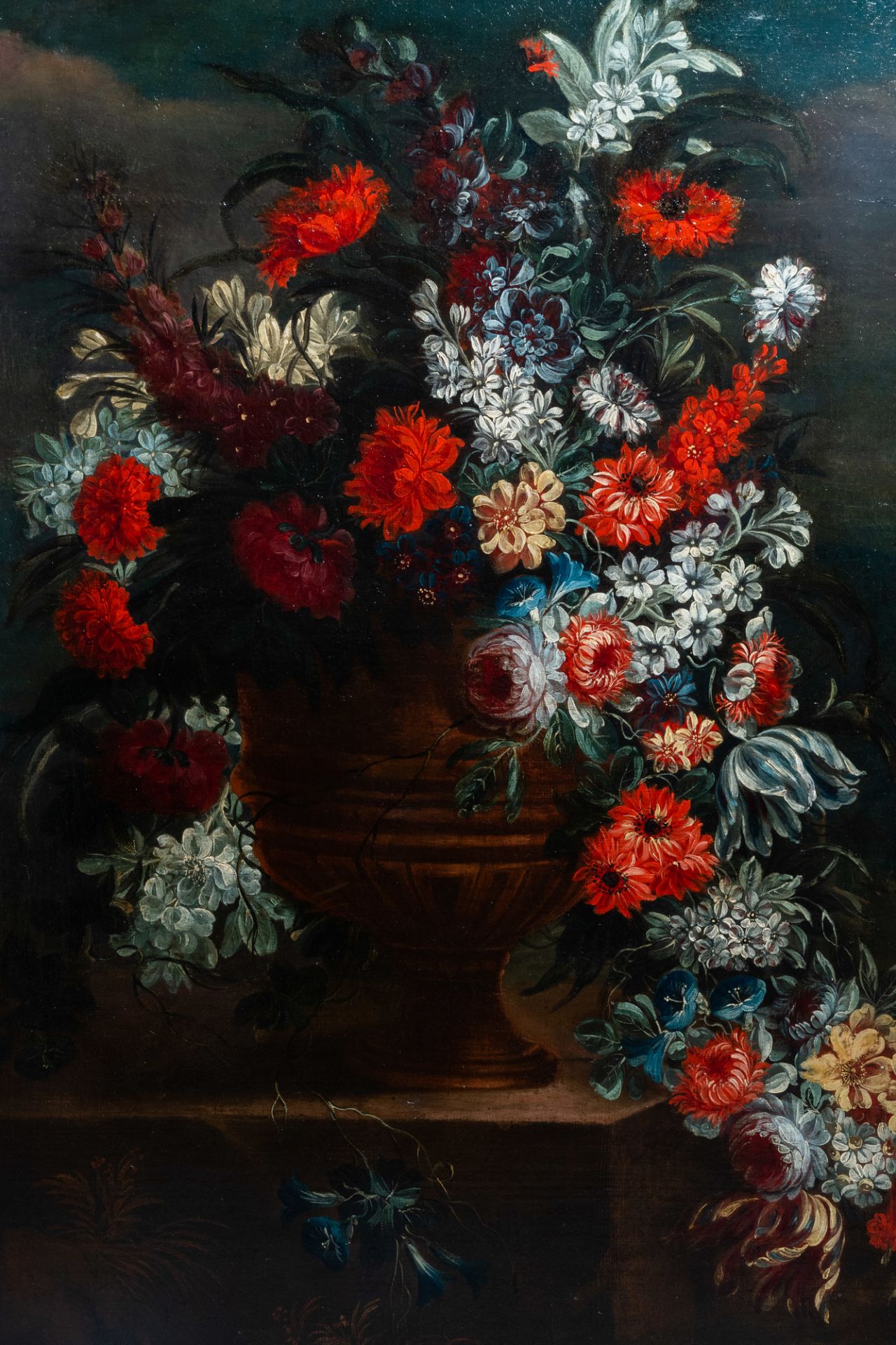 Flemish school, monogrammed V.H.: A bouquet of flowers in an urn, oil on canvas, 18th C.