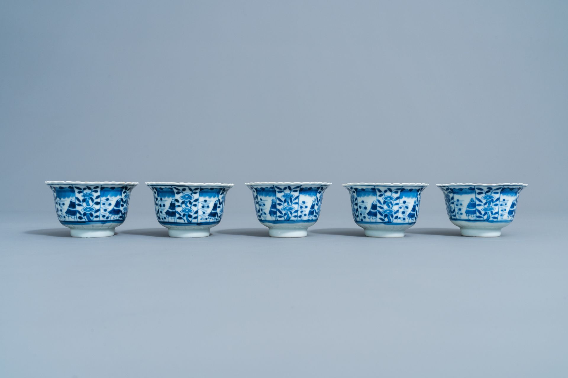 Five Chinese blue and white cups and saucers with landscapes and floral design, Kangxi mark, 19th C. - Image 4 of 9