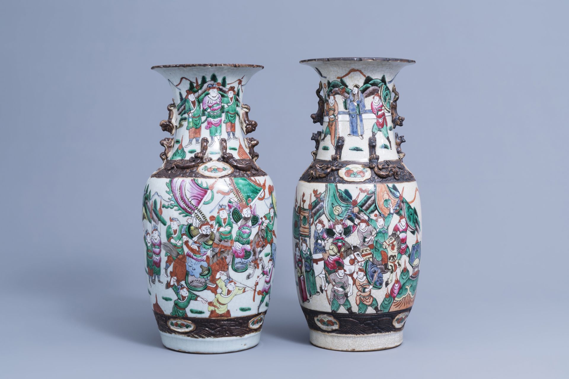 Two Chinese Nanking crackle glazed famille rose vases with warrior scenes, 19th/20th C.