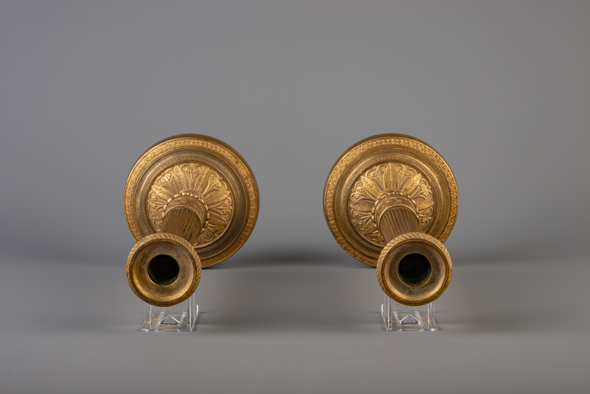 A pair of French Neoclassical gilt bronze candlesticks, 19th C. - Image 5 of 7