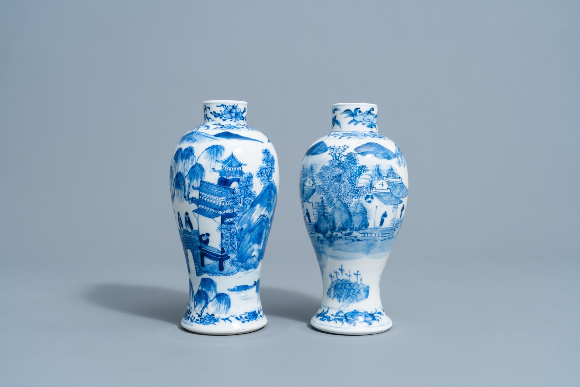 Two Chinese blue & white baluster vases with a mountain landscape, Kangxi mark, 19th C. - Image 2 of 6