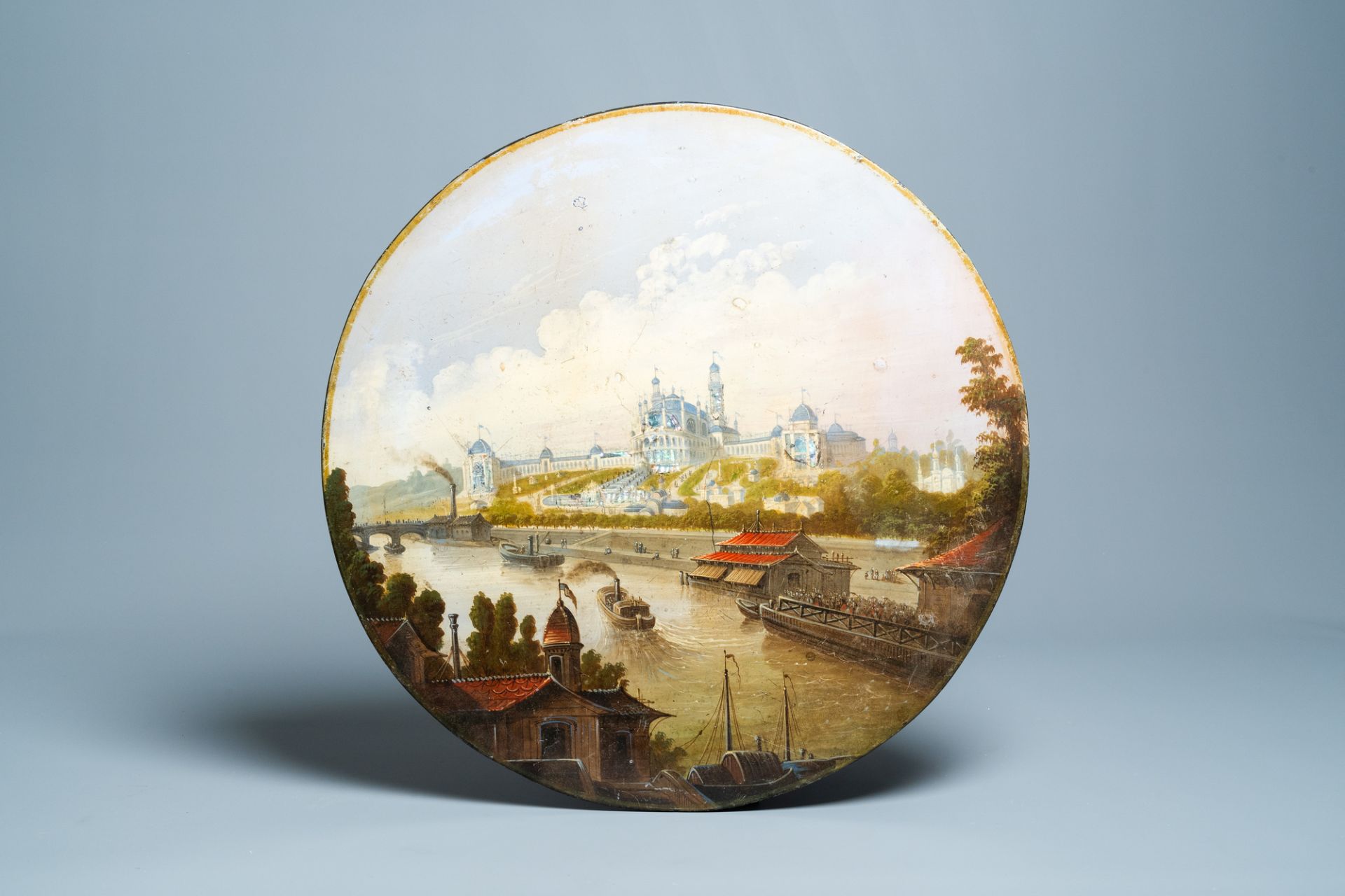 A circular probably Russian signboard or tabletop with mother-of-pearl depicting a waterfront palace