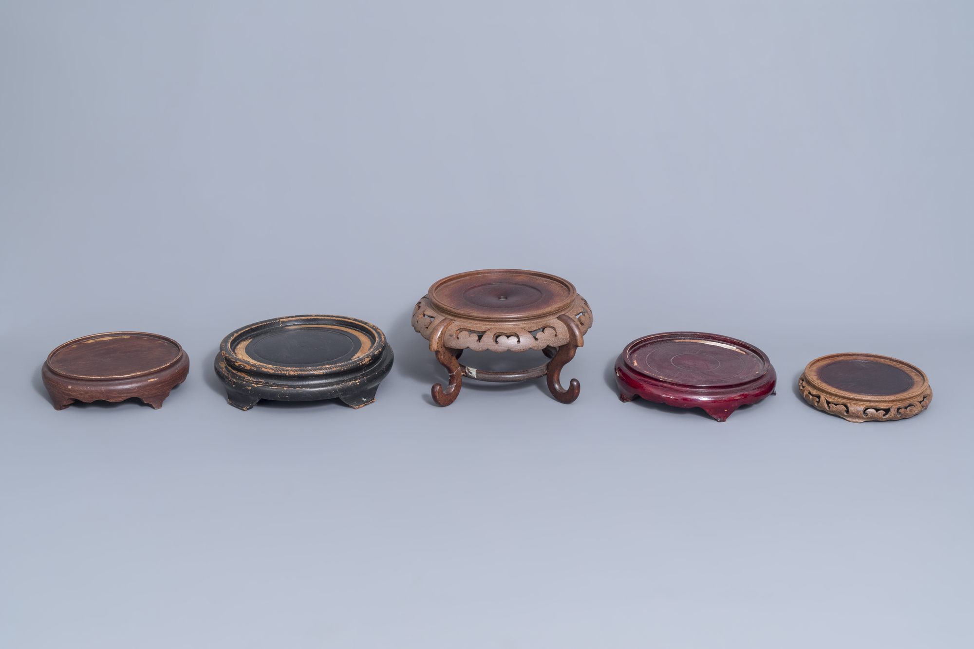 A collection of Chinese wooden stands and a carved wooden stand with marble top, 19th/20th C. - Image 5 of 14