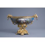 A large French Sevres style porcelain gilt bronze mounted oval bowl with floral design and gallant s