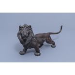 A Japanese bronze sculpture of a lion, probably signed Toku Ya, Meiji, 19th/20th C.