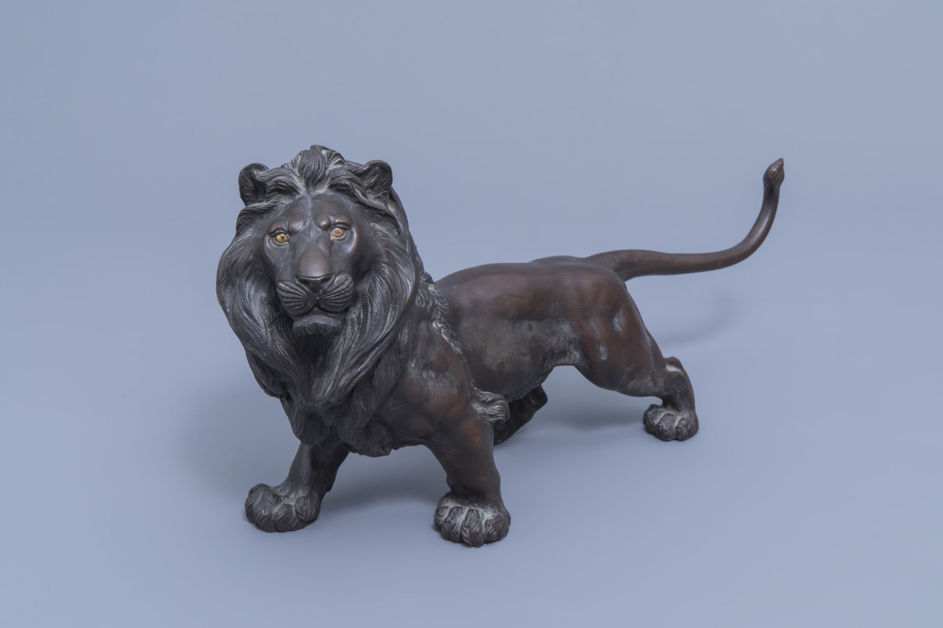 A Japanese bronze sculpture of a lion, probably signed Toku Ya, Meiji, 19th/20th C.