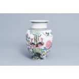 A Chinese famille rose vase with various birds among blossoming branches, Qianlong mark, Republic, 2