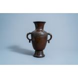 A Chinese archaic bronze vase with 'dragon' handles, Qing