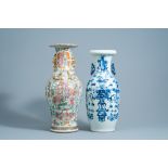 A Chinese Canton famille rose baluster vase and a blue and white 'antiquities' vase, 19th C.