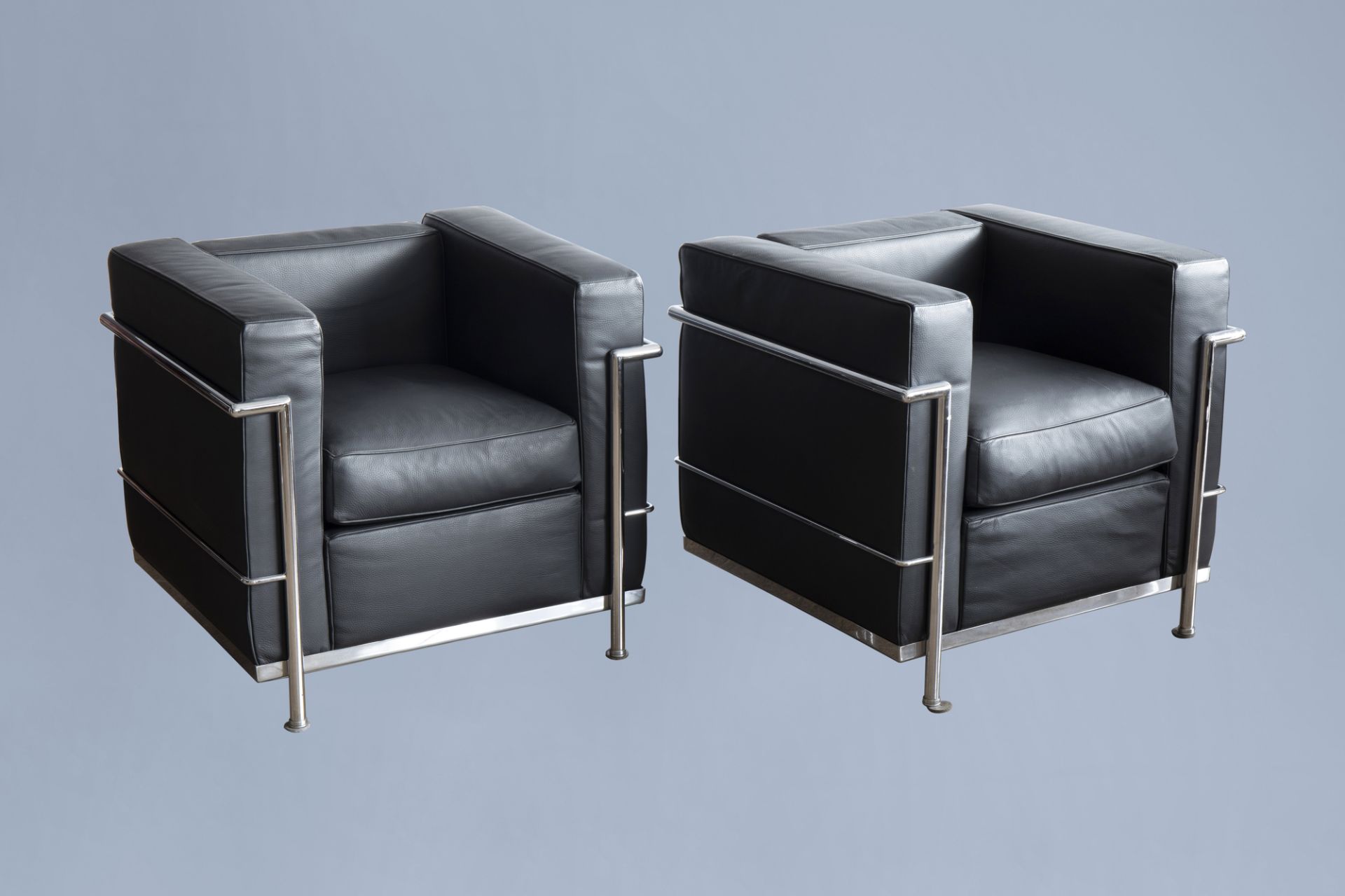After Le Corbusier (1887-1965): Two LC2 style black leather armchairs, 20th C.