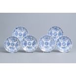 Six Chinese blue and white dishes with floral design and raised central medallion, Kangxi/Yongzheng