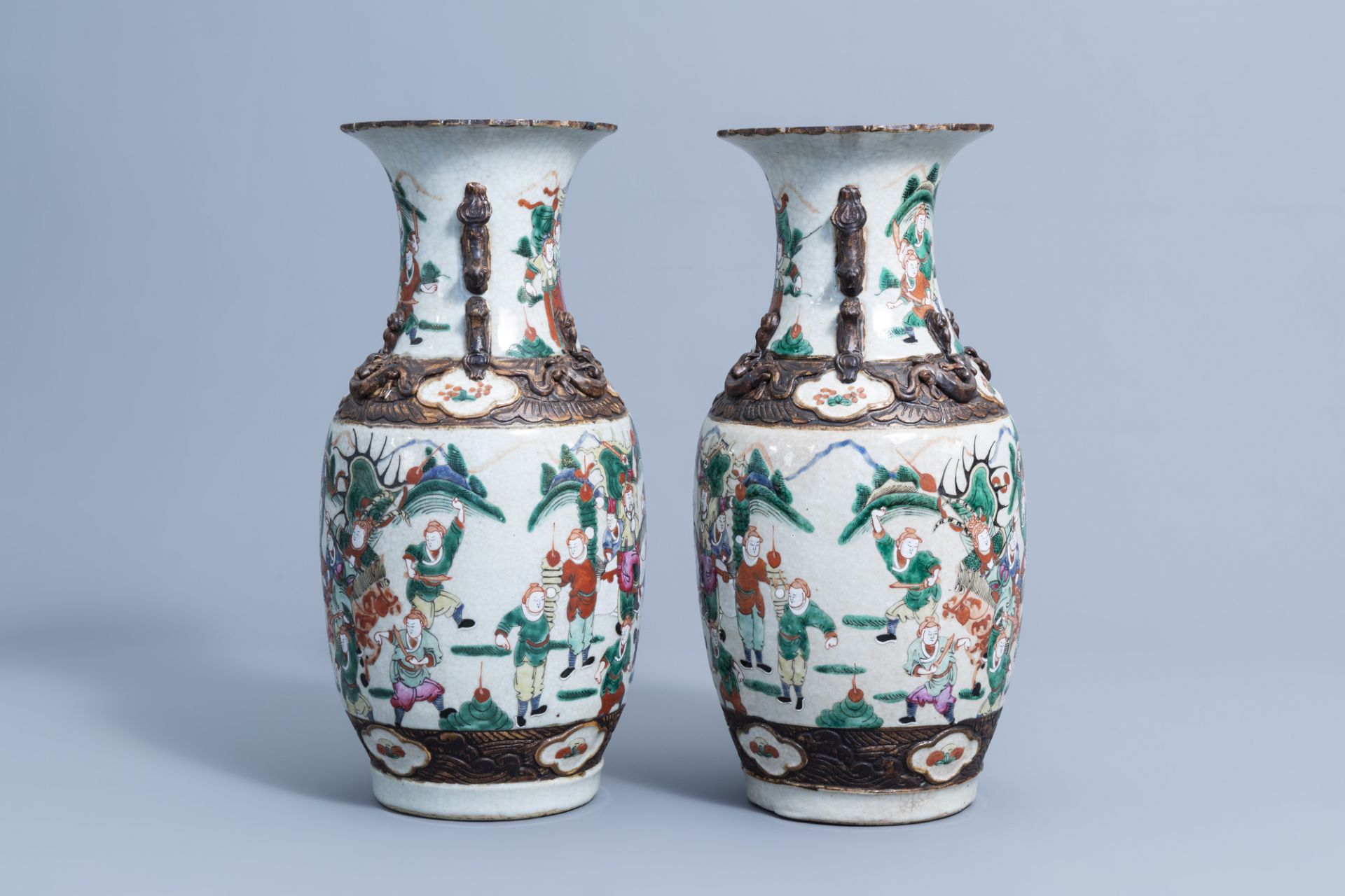 A pair of Chinese Nanking crackle glazed famille rose 'warrior' vases, 19th/20th C. - Image 2 of 6