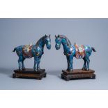 A pair of Chinese cloisonne horses on wooden bases, 20th C.