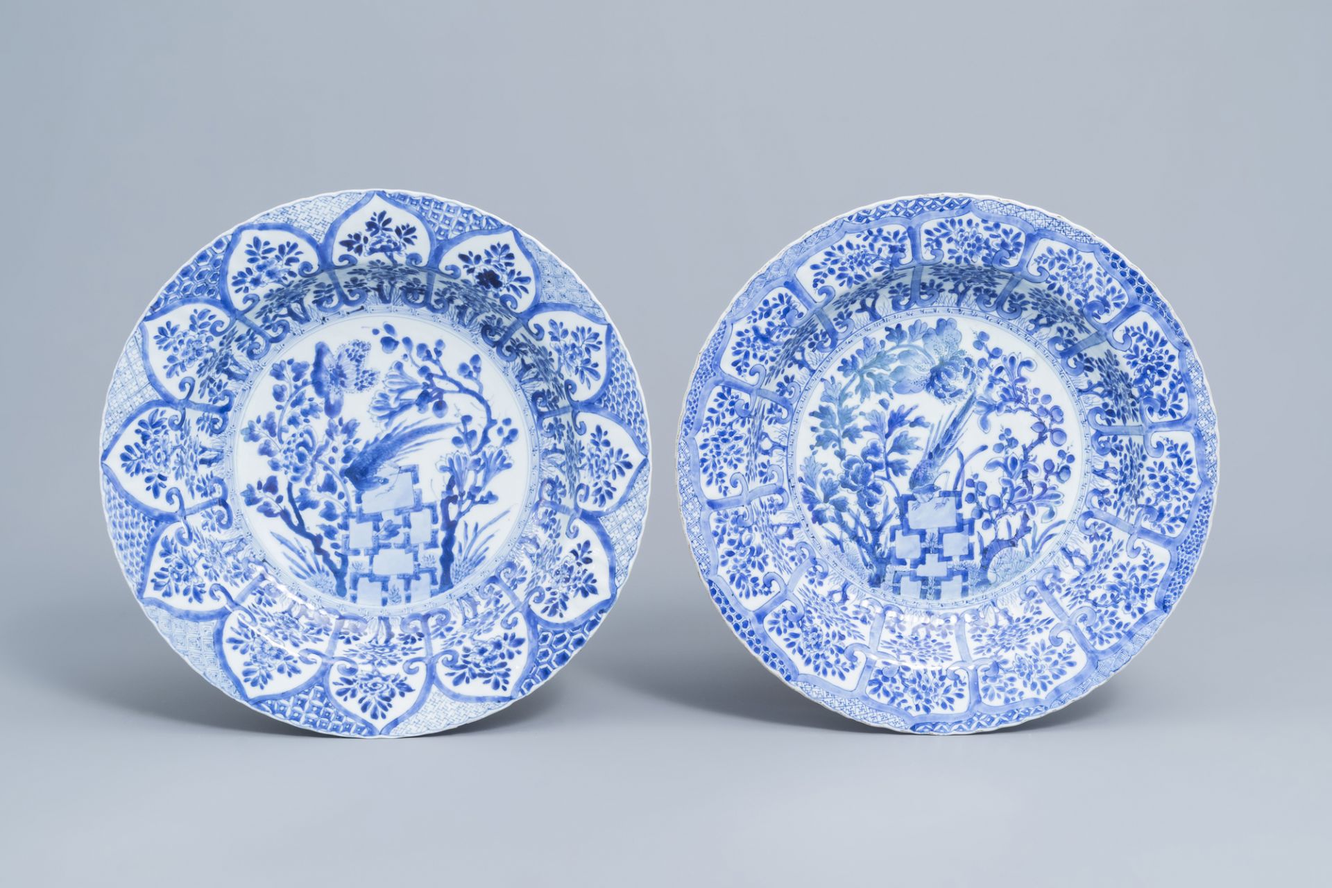 A pair of Chinese blue and white 'pheasant' chargers, Kangxi