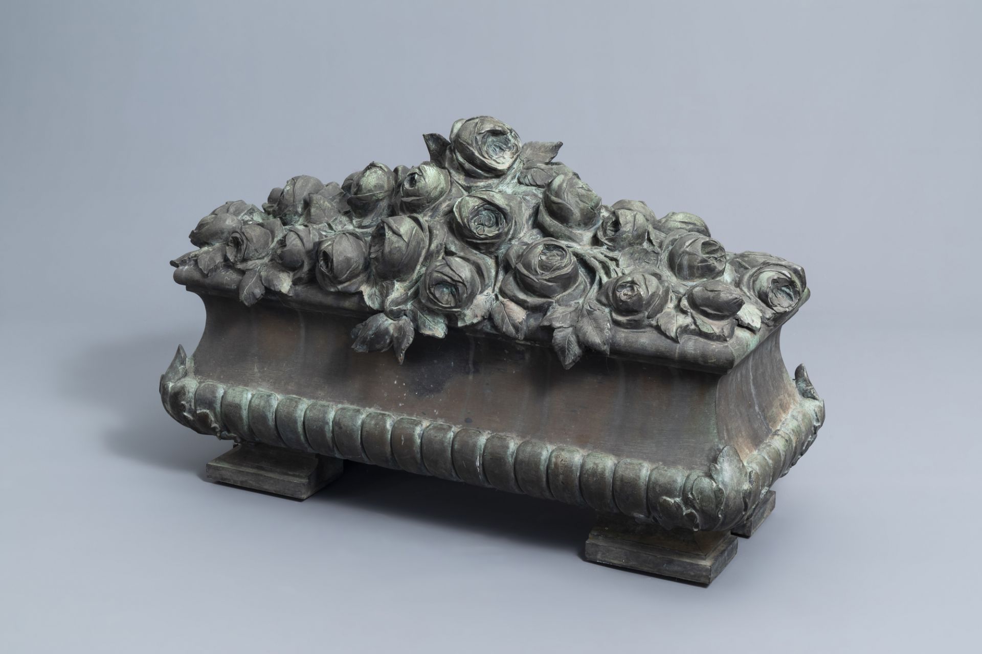 Jean Rabiant (19th/20th C.): A patinated metal garden ornament with floral design